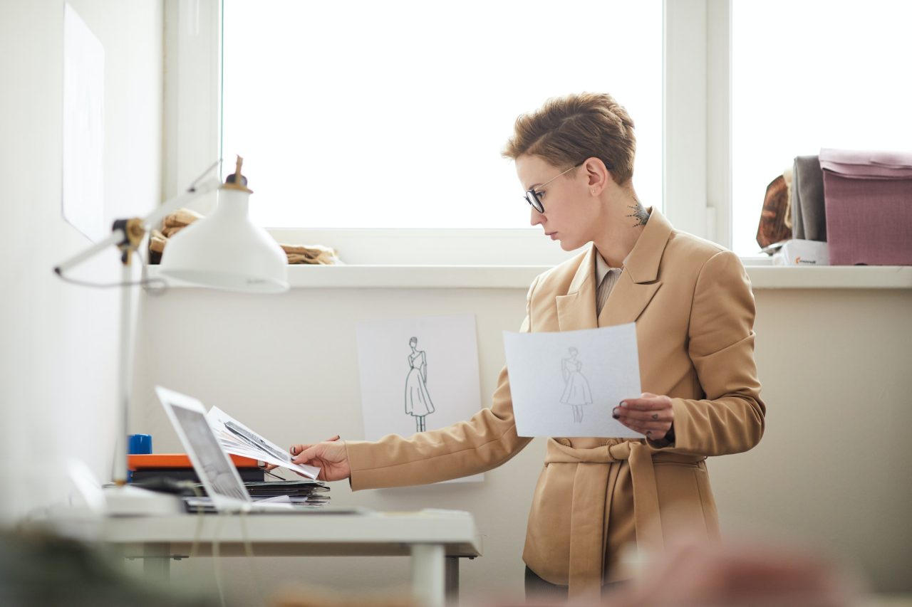 fashion designer with sketches.jpg